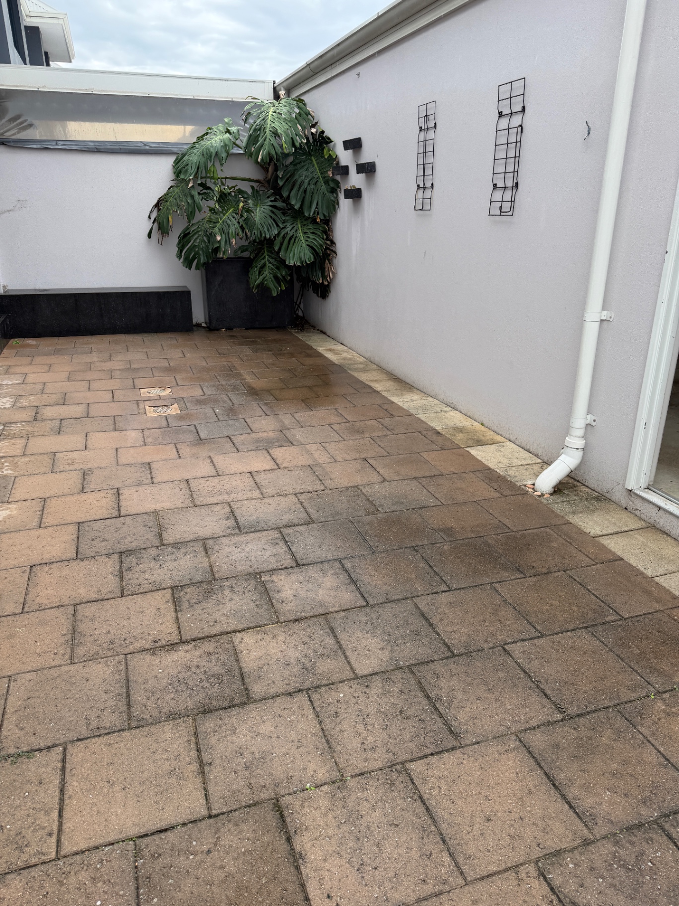 Paved courtyard restoration before